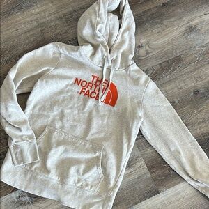 The North Face Cream Hoodie with Orange Logo